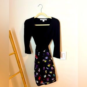 Black DVF wrap dress with floral skirt. Size 2. Worn once.